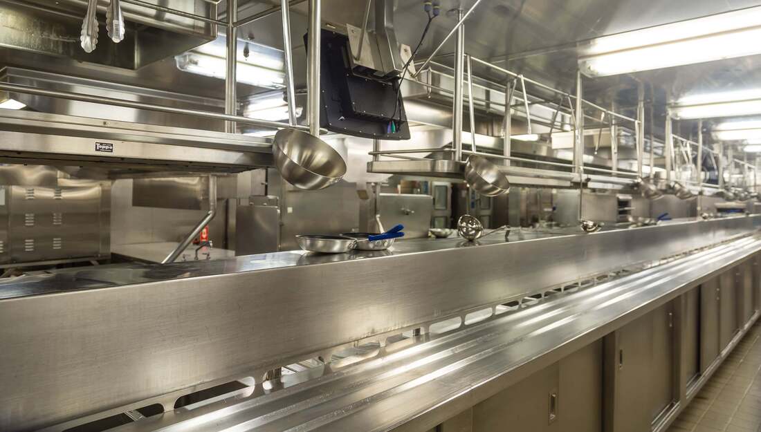 Stainless steel commercial kitchen that has just been deep cleaned