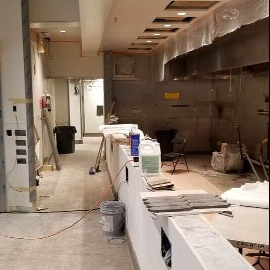 Cleaning equipment spread out within a kitchen